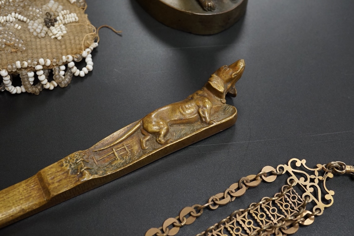 19th century objects to include a bronze lion paperweight, a Palais Royale chamberstick, a beadwork pocket, chatelaine etc